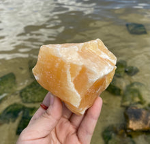 Load image into Gallery viewer, Large Rough Palm Size Orange Calcite
